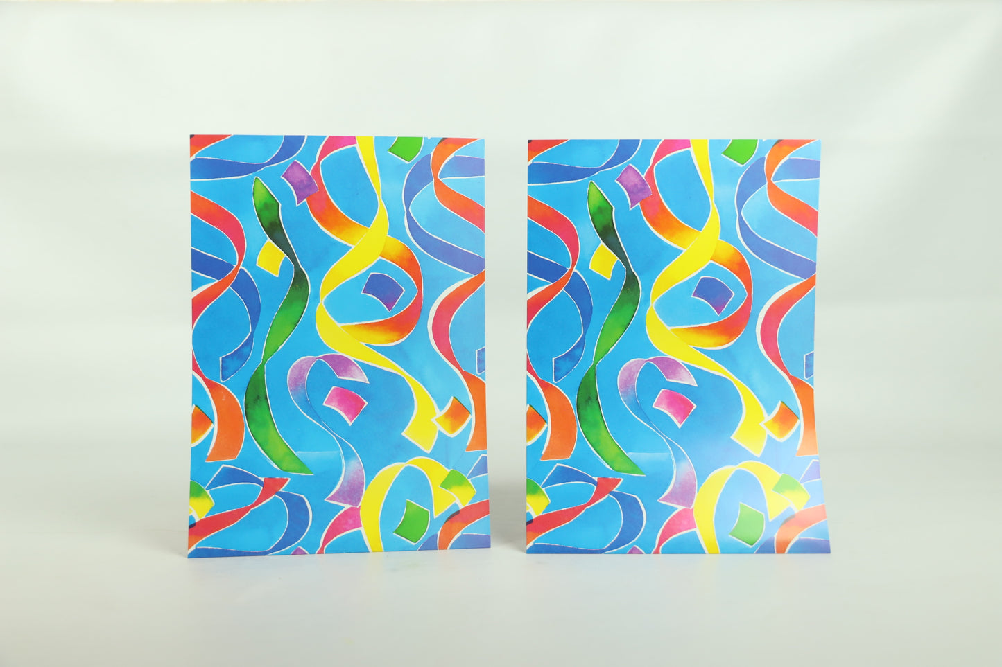 Wrapping Paper Sheets 2x Coloured Streamers on Blue Background